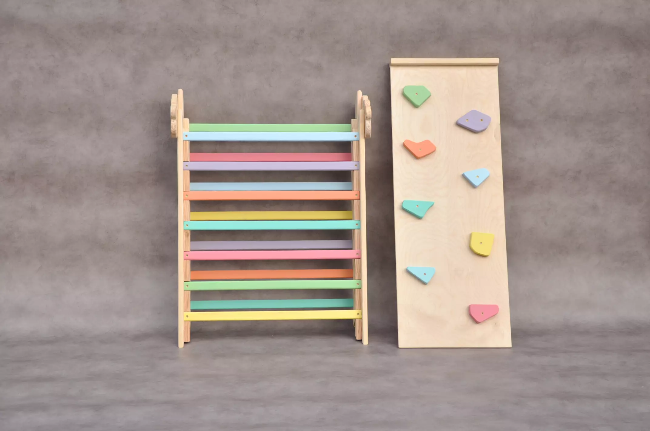 Folding pikler triangle Cloud Rainbow wooden climbing frame with Rocks slide board, special Color Splash edition for cool summer birthday parties and family celebrations. Toddler learning and developmental toys by Barin Toys - move and learn experience.