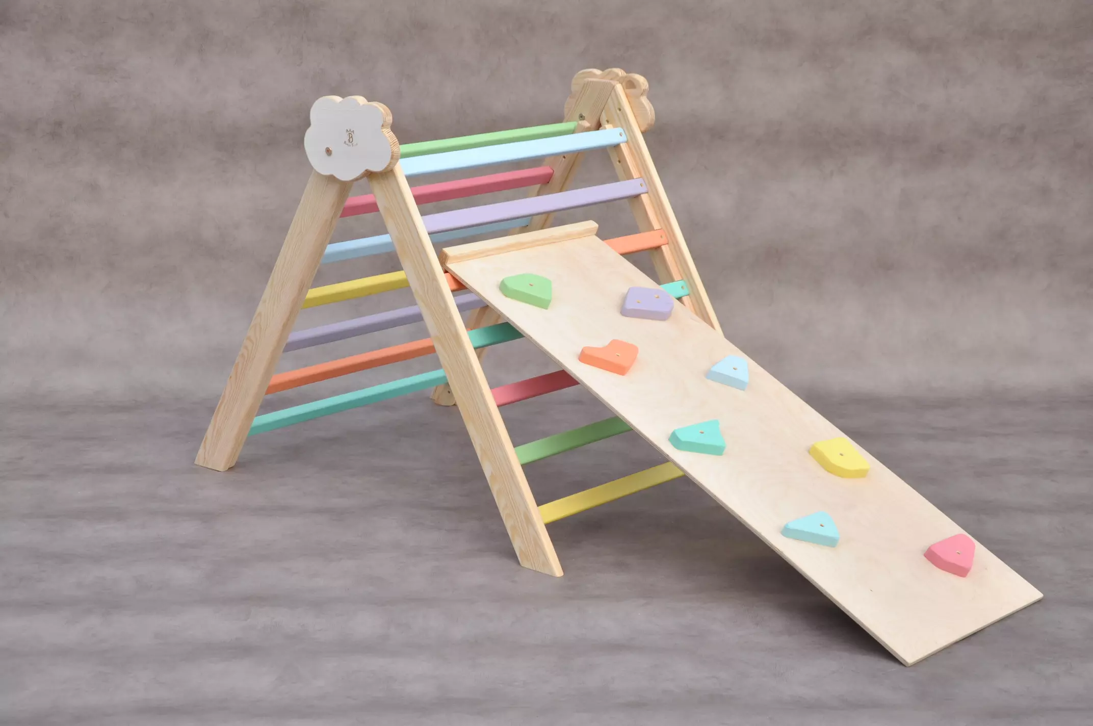 Indoor climbing frame for 1 year old for cool summer birthday parties and family celebrations. Toddler learning and developmental toys by Barin Toys - Cloud Rainbow wooden climbing frame with Rocks slide - move and learn experience.