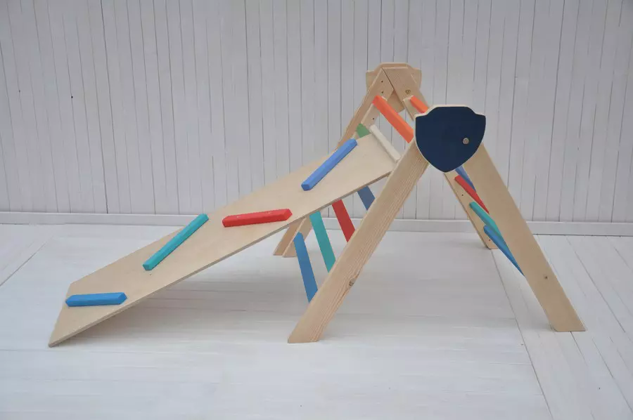 Indoor climbing frame with slide for toddler climbing and ball runner.